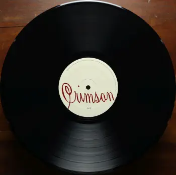 <u>PRESSING INFO</u><br><table class=inf_press><tbody><tr class=inf_info><td class=inf_title>Album:</td><td class=inf_info> Crimson on US Black  </td></tr>
    <td class=inf_title>Pressing:</td><td> First Pressing /??  </td></tr>
    <td class=inf_title>Release Date:</td><td> 2005  </td></tr>
    <td class=inf_title>Album Pressed:</td><td> 2005  </td></tr>
    <td class=inf_title>Label:</td><td> Vagrant Records VR509  </td></tr>
    <td class=inf_title>Insert:</td><td> Double Sided Glossy  </td></tr>
    <td class=inf_title>Barcode:</td><td> 6 01091-050914  </td></tr>
    <td class=inf_title>Side A Matrix:</td><td> UNIVERSAL VR509 A 4  </td></tr>
    <td class=inf_title>Side B Matrix:</td><td> UNIVERSAL VR509 B 4  </td></tr>
    <td class=inf_title>&nbsp;</td><td> <a href=https://www.discogs.com/release/1428034 target=_blank rel=noopener noreferrer>View This Release on Discogs</a>  </tr></tbody></table>
<br><u>PRICING</u><span class='less' style='padding-left: 8px; color: var(--font-colour_grey);'>(prices shown in USD)</span><br><table class='inf_press'><tbody><tr class='inf_info'>
            <td class='inf_title'>Last Sold:</td>
            <td>$37.00 (Jun 27, 2026)</td>
            </tr><tr class='inf_info'>
            <td class='inf_title'>History:</td>
            <td>
                <span class='price-low' title='Sold on May 7, 2020'>Low: <span class='price-value'>$24.00</span></span>
                <span class='price-separator'>|</span>
                <span class='price-avg'>Avg: <span class='price-value'>$83.90</span></span>
                <span class='price-separator'>|</span>
                <span class='price-high' title='Sold on Aug 21, 2021'>High: <span class='price-value'>$179.99</span></span>
            </td>
            </tr></tbody></table><br>    <br><br><u>TRACKLIST</u><br><table class='inf_tracks'><tbody><tr>
            <td class='inf_num'>A1</td>
            <td class='inf_trk'>Time To Waste</td>
            <td class='inf_len'>4:11</td>
            <td><a href='#' class='lyric-link' data-album-code='crimson' data-song-title='Time To Waste'>Lyrics</a></td></tr><tr>
            <td class='inf_num'>A2</td>
            <td class='inf_trk'>The Poison</td>
            <td class='inf_len'>2:04</td>
            <td><a href='#' class='lyric-link' data-album-code='crimson' data-song-title='The Poison'>Lyrics</a></td></tr><tr>
            <td class='inf_num'>A3</td>
            <td class='inf_trk'>Burn</td>
            <td class='inf_len'>4:05</td>
            <td><a href='#' class='lyric-link' data-album-code='crimson' data-song-title='Burn'>Lyrics</a></td></tr><tr>
            <td class='inf_num'>A4</td>
            <td class='inf_trk'>Mercy Me</td>
            <td class='inf_len'>2:49</td>
            <td><a href='#' class='lyric-link' data-album-code='crimson' data-song-title='Mercy Me'>Lyrics</a></td></tr><tr>
            <td class='inf_num'>A5</td>
            <td class='inf_trk'>Dethbed</td>
            <td class='inf_len'>3:03</td>
            <td><a href='#' class='lyric-link' data-album-code='crimson' data-song-title='Dethbed'>Lyrics</a></td></tr><tr>
            <td class='inf_num'>A6</td>
            <td class='inf_trk'>Settle For Satin</td>
            <td class='inf_len'>3:49</td>
            <td><a href='#' class='lyric-link' data-album-code='crimson' data-song-title='Settle For Satin'>Lyrics</a></td></tr><tr>
            <td class='inf_num'>A7</td>
            <td class='inf_trk'>Sadie</td>
            <td class='inf_len'>4:39</td>
            <td><a href='#' class='lyric-link' data-album-code='crimson' data-song-title='Sadie'>Lyrics</a></td></tr><tr>
            <td class='inf_num'>B1</td>
            <td class='inf_trk'>Fall Victim</td>
            <td class='inf_len'>3:18</td>
            <td><a href='#' class='lyric-link' data-album-code='crimson' data-song-title='Fall Victim'>Lyrics</a></td></tr><tr>
            <td class='inf_num'>B2</td>
            <td class='inf_trk'>I Was A Prayer</td>
            <td class='inf_len'>2:36</td>
            <td><a href='#' class='lyric-link' data-album-code='crimson' data-song-title='I Was A Prayer'>Lyrics</a></td></tr><tr>
            <td class='inf_num'>B3</td>
            <td class='inf_trk'>Prevent This Tragedy</td>
            <td class='inf_len'>3:06</td>
            <td><a href='#' class='lyric-link' data-album-code='crimson' data-song-title='Prevent This Tragedy'>Lyrics</a></td></tr><tr>
            <td class='inf_num'>B4</td>
            <td class='inf_trk'>Back To Hell</td>
            <td class='inf_len'>2:54</td>
            <td><a href='#' class='lyric-link' data-album-code='crimson' data-song-title='Back To Hell'>Lyrics</a></td></tr><tr>
            <td class='inf_num'>B5</td>
            <td class='inf_trk'>Your Neck</td>
            <td class='inf_len'>3:15</td>
            <td><a href='#' class='lyric-link' data-album-code='crimson' data-song-title='Your Neck'>Lyrics</a></td></tr><tr>
            <td class='inf_num'>B6</td>
            <td class='inf_trk'>Smoke</td>
            <td class='inf_len'>2:59</td>
            <td><a href='#' class='lyric-link' data-album-code='crimson' data-song-title='Smoke'>Lyrics</a></td></tr></tbody></table><br><br>
    <u>NOTES</u><br> There were quite a few copies of this album sent out as 'promos' to radio stations and record stores, and those copies usually have a punch out or hole through the barcode. These are identical to the version you could buy in store.
 - B