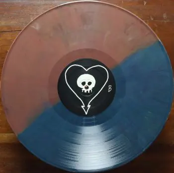 <u>PRESSING INFO</u><br><table class=inf_press><tbody><tr class=inf_info><td class=inf_title>Album:</td><td class=inf_info> Goddamnit Redux on Random Colour 'Half Blue / Half Brown'  </td></tr>
    <td class=inf_title>Pressing:</td><td> Sixteenth Pressing /1000  </td></tr>
    <td class=inf_title>Release Date:</td><td> Feb. 15th 2021  </td></tr>
    <td class=inf_title>Album Pressed:</td><td> 2021  </td></tr>
    <td class=inf_title>Label:</td><td> Asianman Records AM-160  </td></tr>
    <td class=inf_title>Insert:</td><td> Double Sided Glossy  </td></tr>
    <td class=inf_title>Barcode:</td><td> 6 12851-01601 9  </td></tr>
    <td class=inf_title>Side A Matrix:</td><td> [etched] AM-160-A S-65748 [stamped] GOLDEN  </td></tr>
    <td class=inf_title>Side B Matrix:</td><td> [etched] AM-160-B S-65749 [stamped] GOLDEN  </td></tr>
    <td class=inf_title>&nbsp;</td><td> <a href=https://www.discogs.com/release/17544028-Alkaline-Trio-Goddamnit target=_blank rel=noopener noreferrer>View This Release on Discogs</a>  </tr></tbody></table>
<br><u>PRICING</u><span class='less' style='padding-left: 8px; color: var(--font-colour_grey);'>(prices shown in USD)</span><br><table class='inf_press'><tbody><tr class='inf_info'>
            <td class='inf_title'>Last Sold:</td>
            <td>$33.15 (Feb 7, 2025)</td>
            </tr><tr class='inf_info'>
            <td class='inf_title'>History:</td>
            <td>
                <span class='price-low' title='Sold on Aug 29, 2021'>Low: <span class='price-value'>$15.00</span></span>
                <span class='price-separator'>|</span>
                <span class='price-avg'>Avg: <span class='price-value'>$29.77</span></span>
                <span class='price-separator'>|</span>
                <span class='price-high' title='Sold on Jun 17, 2021'>High: <span class='price-value'>$39.99</span></span>
            </td>
            </tr></tbody></table><br>    <br><br><u>TRACKLIST</u><br><table class='inf_tracks'><tbody><tr>
            <td class='inf_num'>A1</td>
            <td class='inf_trk'>Cringe</td>
            <td class='inf_len'>2:23</td>
            <td><a href='#' class='lyric-link' data-album-code='gd' data-song-title='Cringe'>Lyrics</a></td></tr><tr>
            <td class='inf_num'>A2</td>
            <td class='inf_trk'>Cop</td>
            <td class='inf_len'>2:18</td>
            <td><a href='#' class='lyric-link' data-album-code='gd' data-song-title='Cop'>Lyrics</a></td></tr><tr>
            <td class='inf_num'>A3</td>
            <td class='inf_trk'>San Francisco</td>
            <td class='inf_len'>3:52</td>
            <td><a href='#' class='lyric-link' data-album-code='gd' data-song-title='San Francisco'>Lyrics</a></td></tr><tr>
            <td class='inf_num'>A4</td>
            <td class='inf_trk'>Nose Over Tail</td>
            <td class='inf_len'>2:37</td>
            <td><a href='#' class='lyric-link' data-album-code='gd' data-song-title='Nose Over Tail'>Lyrics</a></td></tr><tr>
            <td class='inf_num'>A5</td>
            <td class='inf_trk'>As You Were</td>
            <td class='inf_len'>2:11</td>
            <td><a href='#' class='lyric-link' data-album-code='gd' data-song-title='As You Were'>Lyrics</a></td></tr><tr>
            <td class='inf_num'>A6</td>
            <td class='inf_trk'>Enjoy Your Day</td>
            <td class='inf_len'>2:17</td>
            <td><a href='#' class='lyric-link' data-album-code='gd' data-song-title='Enjoy Your Day'>Lyrics</a></td></tr><tr>
            <td class='inf_num'>A7</td>
            <td class='inf_trk'>Clavicle</td>
            <td class='inf_len'>2:28</td>
            <td><a href='#' class='lyric-link' data-album-code='gd' data-song-title='Clavicle'>Lyrics</a></td></tr><tr>
            <td class='inf_num'>B1</td>
            <td class='inf_trk'>My Little Needle</td>
            <td class='inf_len'>3:01</td>
            <td><a href='#' class='lyric-link' data-album-code='gd' data-song-title='My Little Needle'>Lyrics</a></td></tr><tr>
            <td class='inf_num'>B2</td>
            <td class='inf_trk'>Southern Rock</td>
            <td class='inf_len'>3:05</td>
            <td><a href='#' class='lyric-link' data-album-code='gd' data-song-title='Southern Rock'>Lyrics</a></td></tr><tr>
            <td class='inf_num'>B3</td>
            <td class='inf_trk'>Message From Kathlene</td>
            <td class='inf_len'>3:22</td>
            <td><a href='#' class='lyric-link' data-album-code='gd' data-song-title='Message From Kathlene'>Lyrics</a></td></tr><tr>
            <td class='inf_num'>B4</td>
            <td class='inf_trk'>Trouble Breathing</td>
            <td class='inf_len'>3:55</td>
            <td><a href='#' class='lyric-link' data-album-code='gd' data-song-title='Trouble Breathing'>Lyrics</a></td></tr><tr>
            <td class='inf_num'>B5</td>
            <td class='inf_trk'>Sorry About That</td>
            <td class='inf_len'>3:21</td>
            <td><a href='#' class='lyric-link' data-album-code='gd' data-song-title='Sorry About That'>Lyrics</a></td></tr></tbody></table><br><br>
    <u>NOTES</u><br> Thin white border around insert. Former DVD order form is now covered by Heart/Skull logos. Center labels are black Heart/Skull logos. The sleeve of this release has a flat finish, compared to previous pressings that had glossy features.
 - B