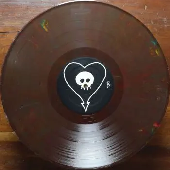 <u>PRESSING INFO</u><br><table class=inf_press><tbody><tr class=inf_info><td class=inf_title>Album:</td><td class=inf_info> Goddamnit Redux on Random Colour 'Brown with Rainbow Flecks' (Retail Exclusive)  </td></tr>
    <td class=inf_title>Pressing:</td><td> Eighteenth Pressing /500  </td></tr>
    <td class=inf_title>Release Date:</td><td> Mar. 1st 2022  </td></tr>
    <td class=inf_title>Album Pressed:</td><td> 2022  </td></tr>
    <td class=inf_title>Label:</td><td> Asianman Records AM-160  </td></tr>
    <td class=inf_title>Insert:</td><td> Double Sided Glossy  </td></tr>
    <td class=inf_title>Barcode:</td><td> 6 12851-01601 9  </td></tr>
    <td class=inf_title>Side A Matrix:</td><td> [etched] AM-160-A S-65748 [stamped] GOLDEN  </td></tr>
    <td class=inf_title>Side B Matrix:</td><td> [etched] AM-160-B S-65749 [stamped] GOLDEN  </td></tr>
    <td class=inf_title>&nbsp;</td><td> <a href=https://www.discogs.com/release/22437724-Alkaline-Trio-Goddamnit target=_blank rel=noopener noreferrer>View This Release on Discogs</a>  </tr></tbody></table>
<br><u>PRICING</u><span class='less' style='padding-left: 8px; color: var(--font-colour_grey);'>(prices shown in USD)</span><br><table class='inf_press'><tbody><tr class='inf_info'>
            <td class='inf_title'>Last Sold:</td>
            <td>$25.00 (Jul 3, 2026)</td>
            </tr><tr class='inf_info'>
            <td class='inf_title'>History:</td>
            <td>
                <span class='price-low' title='Sold on Apr 27, 2023'>Low: <span class='price-value'>$14.99</span></span>
                <span class='price-separator'>|</span>
                <span class='price-avg'>Avg: <span class='price-value'>$21.07</span></span>
                <span class='price-separator'>|</span>
                <span class='price-high' title='Sold on Jan 26, 2025'>High: <span class='price-value'>$30.00</span></span>
            </td>
            </tr></tbody></table><br>    <br><br><u>TRACKLIST</u><br><table class='inf_tracks'><tbody><tr>
            <td class='inf_num'>A1</td>
            <td class='inf_trk'>Cringe</td>
            <td class='inf_len'>2:23</td>
            <td><a href='#' class='lyric-link' data-album-code='gd' data-song-title='Cringe'>Lyrics</a></td></tr><tr>
            <td class='inf_num'>A2</td>
            <td class='inf_trk'>Cop</td>
            <td class='inf_len'>2:18</td>
            <td><a href='#' class='lyric-link' data-album-code='gd' data-song-title='Cop'>Lyrics</a></td></tr><tr>
            <td class='inf_num'>A3</td>
            <td class='inf_trk'>San Francisco</td>
            <td class='inf_len'>3:52</td>
            <td><a href='#' class='lyric-link' data-album-code='gd' data-song-title='San Francisco'>Lyrics</a></td></tr><tr>
            <td class='inf_num'>A4</td>
            <td class='inf_trk'>Nose Over Tail</td>
            <td class='inf_len'>2:37</td>
            <td><a href='#' class='lyric-link' data-album-code='gd' data-song-title='Nose Over Tail'>Lyrics</a></td></tr><tr>
            <td class='inf_num'>A5</td>
            <td class='inf_trk'>As You Were</td>
            <td class='inf_len'>2:11</td>
            <td><a href='#' class='lyric-link' data-album-code='gd' data-song-title='As You Were'>Lyrics</a></td></tr><tr>
            <td class='inf_num'>A6</td>
            <td class='inf_trk'>Enjoy Your Day</td>
            <td class='inf_len'>2:17</td>
            <td><a href='#' class='lyric-link' data-album-code='gd' data-song-title='Enjoy Your Day'>Lyrics</a></td></tr><tr>
            <td class='inf_num'>A7</td>
            <td class='inf_trk'>Clavicle</td>
            <td class='inf_len'>2:28</td>
            <td><a href='#' class='lyric-link' data-album-code='gd' data-song-title='Clavicle'>Lyrics</a></td></tr><tr>
            <td class='inf_num'>B1</td>
            <td class='inf_trk'>My Little Needle</td>
            <td class='inf_len'>3:01</td>
            <td><a href='#' class='lyric-link' data-album-code='gd' data-song-title='My Little Needle'>Lyrics</a></td></tr><tr>
            <td class='inf_num'>B2</td>
            <td class='inf_trk'>Southern Rock</td>
            <td class='inf_len'>3:05</td>
            <td><a href='#' class='lyric-link' data-album-code='gd' data-song-title='Southern Rock'>Lyrics</a></td></tr><tr>
            <td class='inf_num'>B3</td>
            <td class='inf_trk'>Message From Kathlene</td>
            <td class='inf_len'>3:22</td>
            <td><a href='#' class='lyric-link' data-album-code='gd' data-song-title='Message From Kathlene'>Lyrics</a></td></tr><tr>
            <td class='inf_num'>B4</td>
            <td class='inf_trk'>Trouble Breathing</td>
            <td class='inf_len'>3:55</td>
            <td><a href='#' class='lyric-link' data-album-code='gd' data-song-title='Trouble Breathing'>Lyrics</a></td></tr><tr>
            <td class='inf_num'>B5</td>
            <td class='inf_trk'>Sorry About That</td>
            <td class='inf_len'>3:21</td>
            <td><a href='#' class='lyric-link' data-album-code='gd' data-song-title='Sorry About That'>Lyrics</a></td></tr></tbody></table><br><br>
    <u>NOTES</u><br> Thin white border around insert. Former DVD order form is now covered by Heart/Skull logos. Center labels are black Heart/Skull logos. The sleeve of this release has a flat finish, compared to previous pressings that had glossy features.
 - B