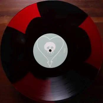 <u>PRESSING INFO</u><br><table class=inf_press><tbody><tr class=inf_info><td class=inf_title>Album:</td><td class=inf_info> Goddamnit Redux on Triple Button 'Red & Black'  </td></tr>
    <td class=inf_title>Pressing:</td><td> Seventeenth Pressing /1000  </td></tr>
    <td class=inf_title>Release Date:</td><td> Nov. 17th 2021  </td></tr>
    <td class=inf_title>Album Pressed:</td><td> 2021  </td></tr>
    <td class=inf_title>Label:</td><td> Asianman Records AM-034 (*AM-160)  </td></tr>
    <td class=inf_title>Insert:</td><td> Double Sided Glossy  </td></tr>
    <td class=inf_title>Barcode:</td><td> 6 12851-01601 9  </td></tr>
    <td class=inf_title>Side A Matrix:</td><td> PIRATES PRESS - AM 034 A 182022E1/B  </td></tr>
    <td class=inf_title>Side B Matrix:</td><td> PIRATES PRESS - AM 034 B 182022E2/A  </td></tr>
    <td class=inf_title>&nbsp;</td><td> <a href=https://www.discogs.com/release/20099506-Alkaline-Trio-Goddamnit target=_blank rel=noopener noreferrer>View This Release on Discogs</a>  </tr></tbody></table>
<br><u>PRICING</u><span class='less' style='padding-left: 8px; color: var(--font-colour_grey);'>(prices shown in USD)</span><br><table class='inf_press'><tbody><tr class='inf_info'>
            <td class='inf_title'>Last Sold:</td>
            <td>$19.99 (Jan 29, 2026)</td>
            </tr><tr class='inf_info'>
            <td class='inf_title'>History:</td>
            <td>
                <span class='price-low' title='Sold on Jan 29, 2022'>Low: <span class='price-value'>$15.99</span></span>
                <span class='price-separator'>|</span>
                <span class='price-avg'>Avg: <span class='price-value'>$25.58</span></span>
                <span class='price-separator'>|</span>
                <span class='price-high' title='Sold on Feb 9, 2022'>High: <span class='price-value'>$44.99</span></span>
            </td>
            </tr></tbody></table><br>    <br><br><u>TRACKLIST</u><br><table class='inf_tracks'><tbody><tr>
            <td class='inf_num'>A1</td>
            <td class='inf_trk'>Cringe</td>
            <td class='inf_len'>2:23</td>
            <td><a href='#' class='lyric-link' data-album-code='gd' data-song-title='Cringe'>Lyrics</a></td></tr><tr>
            <td class='inf_num'>A2</td>
            <td class='inf_trk'>Cop</td>
            <td class='inf_len'>2:18</td>
            <td><a href='#' class='lyric-link' data-album-code='gd' data-song-title='Cop'>Lyrics</a></td></tr><tr>
            <td class='inf_num'>A3</td>
            <td class='inf_trk'>San Francisco</td>
            <td class='inf_len'>3:52</td>
            <td><a href='#' class='lyric-link' data-album-code='gd' data-song-title='San Francisco'>Lyrics</a></td></tr><tr>
            <td class='inf_num'>A4</td>
            <td class='inf_trk'>Nose Over Tail</td>
            <td class='inf_len'>2:37</td>
            <td><a href='#' class='lyric-link' data-album-code='gd' data-song-title='Nose Over Tail'>Lyrics</a></td></tr><tr>
            <td class='inf_num'>A5</td>
            <td class='inf_trk'>As You Were</td>
            <td class='inf_len'>2:11</td>
            <td><a href='#' class='lyric-link' data-album-code='gd' data-song-title='As You Were'>Lyrics</a></td></tr><tr>
            <td class='inf_num'>A6</td>
            <td class='inf_trk'>Enjoy Your Day</td>
            <td class='inf_len'>2:17</td>
            <td><a href='#' class='lyric-link' data-album-code='gd' data-song-title='Enjoy Your Day'>Lyrics</a></td></tr><tr>
            <td class='inf_num'>A7</td>
            <td class='inf_trk'>Clavicle</td>
            <td class='inf_len'>2:28</td>
            <td><a href='#' class='lyric-link' data-album-code='gd' data-song-title='Clavicle'>Lyrics</a></td></tr><tr>
            <td class='inf_num'>B1</td>
            <td class='inf_trk'>My Little Needle</td>
            <td class='inf_len'>3:01</td>
            <td><a href='#' class='lyric-link' data-album-code='gd' data-song-title='My Little Needle'>Lyrics</a></td></tr><tr>
            <td class='inf_num'>B2</td>
            <td class='inf_trk'>Southern Rock</td>
            <td class='inf_len'>3:05</td>
            <td><a href='#' class='lyric-link' data-album-code='gd' data-song-title='Southern Rock'>Lyrics</a></td></tr><tr>
            <td class='inf_num'>B3</td>
            <td class='inf_trk'>Message From Kathlene</td>
            <td class='inf_len'>3:22</td>
            <td><a href='#' class='lyric-link' data-album-code='gd' data-song-title='Message From Kathlene'>Lyrics</a></td></tr><tr>
            <td class='inf_num'>B4</td>
            <td class='inf_trk'>Trouble Breathing</td>
            <td class='inf_len'>3:55</td>
            <td><a href='#' class='lyric-link' data-album-code='gd' data-song-title='Trouble Breathing'>Lyrics</a></td></tr><tr>
            <td class='inf_num'>B5</td>
            <td class='inf_trk'>Sorry About That</td>
            <td class='inf_len'>3:21</td>
            <td><a href='#' class='lyric-link' data-album-code='gd' data-song-title='Sorry About That'>Lyrics</a></td></tr></tbody></table><br><br>
    <u>NOTES</u><br> The insert now has a thin white border, and the former DVD order form is now covered by Heart/Skull logos. Center labels are now teal Heart/Skull logos instead of the Clock/Skiba. This release has the original Goddamnit catalog number stamped in the runout (AM 034) instead of the correct AM-160. This is the remastered Redux version. The sleeve of this release has a flat finish, compared to previous pressings that had glossy features.
 - B