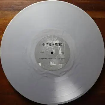 <u>PRESSING INFO</u><br><table class=inf_press><tbody><tr class=inf_info><td class=inf_title>Album:</td><td class=inf_info> Hot Water Music Split on Silver (US Indie Retail Exclusive)  </td></tr>
    <td class=inf_title>Pressing:</td><td> Seventh Pressing /???  </td></tr>
    <td class=inf_title>Release Date:</td><td> July 29th 2022  </td></tr>
    <td class=inf_title>Album Pressed:</td><td> 2022  </td></tr>
    <td class=inf_title>Label:</td><td> Jade Tree Records JT1067 82119-1  </td></tr>
    <td class=inf_title>Insert:</td><td> Printed Glossy Inner Sleeve  </td></tr>
    <td class=inf_title>Barcode:</td><td> 0 45778-21191 3  </td></tr>
    <td class=inf_title>Side A Matrix:</td><td> EPTÂ·82119Â·1Â·A SAFF  </td></tr>
    <td class=inf_title>Side B Matrix:</td><td> EPTÂ·82119Â·1Â·B SAFF  </td></tr>
    <td class=inf_title>&nbsp;</td><td> <a href=https://www.discogs.com/release/24009902 target=_blank rel=noopener noreferrer>View This Release on Discogs</a>  </tr></tbody></table>
<br><u>PRICING</u><span class='less' style='padding-left: 8px; color: var(--font-colour_grey);'>(prices shown in USD)</span><br><table class='inf_press'><tbody><tr class='inf_info'>
            <td class='inf_title'>Last Sold:</td>
            <td><span title='Sold for A$50.00'>$35.00</span> (Jun 14, 2026)</td>
            </tr><tr class='inf_info'>
            <td class='inf_title'>History:</td>
            <td>
                <span class='price-low' title='Sold on Nov 7, 2025'>Low: <span class='price-value'>$12.00</span></span>
                <span class='price-separator'>|</span>
                <span class='price-avg'>Avg: <span class='price-value'>$23.23</span></span>
                <span class='price-separator'>|</span>
                <span class='price-high' title='€39.00 · Sold on Oct 2, 2024'>High: <span class='price-value'>$44.42</span></span>
            </td>
            </tr></tbody></table><br>    <br><br><u>TRACKLIST</u><br><table class='inf_tracks'><tbody><tr>
            <td class='inf_num'>A1</td>
            <td class='inf_trk'>Alkaline Trio - Queen Of Pain</td>
            <td class='inf_len'>3:57</td>
            <td><a href='#' class='lyric-link' data-album-code='splits' data-song-title='Alkaline Trio - Queen Of Pain'>Lyrics</a></td></tr><tr>
            <td class='inf_num'>A2</td>
            <td class='inf_trk'>Alkaline Trio - While You’re Waiting</td>
            <td class='inf_len'>4:07</td>
            <td><a href='#' class='lyric-link' data-album-code='splits' data-song-title='Alkaline Trio - While You’re Waiting'>Lyrics</a></td></tr><tr>
            <td class='inf_num'>A3</td>
            <td class='inf_trk'>Alkaline Trio - Rooftops</td>
            <td class='inf_len'>2:15</td>
            <td><a href='#' class='lyric-link' data-album-code='splits' data-song-title='Alkaline Trio - Rooftops'>Lyrics</a></td></tr><tr>
            <td class='inf_num'>B1</td>
            <td class='inf_trk'>Hot Water Music - God Deciding</td>
            <td class='inf_len'>2:37</td>
            <td><a href='#' class='lyric-link' data-album-code='splits' data-song-title='Hot Water Music - God Deciding'>Lyrics</a></td></tr><tr>
            <td class='inf_num'>B2</td>
            <td class='inf_trk'>Hot Water Music - Russian Roulette</td>
            <td class='inf_len'>3:25</td>
            <td><a href='#' class='lyric-link' data-album-code='splits' data-song-title='Hot Water Music - Russian Roulette'>Lyrics</a></td></tr><tr>
            <td class='inf_num'>B3</td>
            <td class='inf_trk'>Hot Water Music - Radio</td>
            <td class='inf_len'>4:12</td>
            <td><a href='#' class='lyric-link' data-album-code='splits' data-song-title='Hot Water Music - Radio'>Lyrics</a></td></tr><tr>
            <td class='inf_num'>B4</td>
            <td class='inf_trk'>Hot Water Music - Bleeder</td>
            <td class='inf_len'>3:13</td>
            <td><a href='#' class='lyric-link' data-album-code='splits' data-song-title='Hot Water Music - Bleeder'>Lyrics</a></td></tr></tbody></table><br><br>
    <u>NOTES</u><br> Printed inner sleeve (Heavier cardstock and slightly glossier finish compared to 1st presses)
 - B