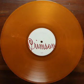 <u>PRESSING INFO</u><br><table class=inf_press><tbody><tr class=inf_info><td class=inf_title>Album:</td><td class=inf_info> Crimson Past Live on Translucent Gold with Black Smoke  </td></tr>
    <td class=inf_title>Pressing:</td><td> First Pressing /500  </td></tr>
    <td class=inf_title>Release Date:</td><td> Dec. 1st 2014  </td></tr>
    <td class=inf_title>Album Pressed:</td><td> 2014  </td></tr>
    <td class=inf_title>Label:</td><td> Vagrant Records VR409  </td></tr>
    <td class=inf_title>Insert:</td><td> Double Sided Glossy  </td></tr>
    <td class=inf_title>Barcode:</td><td> 6 01091-04092 2  </td></tr>
    <td class=inf_title>Side A Matrix:</td><td> 14-0451 A K SST MPO NOISELAND  </td></tr>
    <td class=inf_title>Side B Matrix:</td><td> 14-0451 B MPO K SST NOISELAND  </td></tr>
    <td class=inf_title>&nbsp;</td><td> <a href=https://www.discogs.com/release/6433186 target=_blank rel=noopener noreferrer>View This Release on Discogs</a>  </tr></tbody></table>
<br><u>PRICING</u><span class='less' style='padding-left: 8px; color: var(--font-colour_grey);'>(prices shown in USD)</span><br><table class='inf_press'><tbody><tr class='inf_info'>
            <td class='inf_title'>Last Sold:</td>
            <td>$666.00 (May 19, 2026)</td>
            </tr><tr class='inf_info'>
            <td class='inf_title'>History:</td>
            <td>
                <span class='price-low' title='Sold on Oct 23, 2022'>Low: <span class='price-value'>$79.99</span></span>
                <span class='price-separator'>|</span>
                <span class='price-avg'>Avg: <span class='price-value'>$462.68</span></span>
                <span class='price-separator'>|</span>
                <span class='price-high' title='Sold on Jun 11, 2024'>High: <span class='price-value'>$700.00</span></span>
            </td>
            </tr></tbody></table><br>    <br><br><u>TRACKLIST</u><br><table class='inf_tracks'><tbody><tr>
            <td class='inf_num'>A1</td>
            <td class='inf_trk'>Time To Waste</td>
            <td class='inf_len'>?:??</td>
            <td><a href='#' class='lyric-link' data-album-code='pl' data-song-title='Time To Waste'>Lyrics</a></td></tr><tr>
            <td class='inf_num'>A2</td>
            <td class='inf_trk'>The Poison</td>
            <td class='inf_len'>?:??</td>
            <td><a href='#' class='lyric-link' data-album-code='pl' data-song-title='The Poison'>Lyrics</a></td></tr><tr>
            <td class='inf_num'>A3</td>
            <td class='inf_trk'>Burn</td>
            <td class='inf_len'>?:??</td>
            <td><a href='#' class='lyric-link' data-album-code='pl' data-song-title='Burn'>Lyrics</a></td></tr><tr>
            <td class='inf_num'>A4</td>
            <td class='inf_trk'>Mercy Me</td>
            <td class='inf_len'>?:??</td>
            <td><a href='#' class='lyric-link' data-album-code='pl' data-song-title='Mercy Me'>Lyrics</a></td></tr><tr>
            <td class='inf_num'>A5</td>
            <td class='inf_trk'>Dethbed</td>
            <td class='inf_len'>?:??</td>
            <td><a href='#' class='lyric-link' data-album-code='pl' data-song-title='Dethbed'>Lyrics</a></td></tr><tr>
            <td class='inf_num'>A6</td>
            <td class='inf_trk'>Settle For Satin</td>
            <td class='inf_len'>?:??</td>
            <td><a href='#' class='lyric-link' data-album-code='pl' data-song-title='Settle For Satin'>Lyrics</a></td></tr><tr>
            <td class='inf_num'>A7</td>
            <td class='inf_trk'>Sadie</td>
            <td class='inf_len'>?:??</td>
            <td><a href='#' class='lyric-link' data-album-code='pl' data-song-title='Sadie'>Lyrics</a></td></tr><tr>
            <td class='inf_num'>B1</td>
            <td class='inf_trk'>Fall Victim</td>
            <td class='inf_len'>?:??</td>
            <td><a href='#' class='lyric-link' data-album-code='pl' data-song-title='Fall Victim'>Lyrics</a></td></tr><tr>
            <td class='inf_num'>B2</td>
            <td class='inf_trk'>I Was A Prayer</td>
            <td class='inf_len'>?:??</td>
            <td><a href='#' class='lyric-link' data-album-code='pl' data-song-title='I Was A Prayer'>Lyrics</a></td></tr><tr>
            <td class='inf_num'>B3</td>
            <td class='inf_trk'>Prevent This Tragedy</td>
            <td class='inf_len'>?:??</td>
            <td><a href='#' class='lyric-link' data-album-code='pl' data-song-title='Prevent This Tragedy'>Lyrics</a></td></tr><tr>
            <td class='inf_num'>B4</td>
            <td class='inf_trk'>Back To Hell</td>
            <td class='inf_len'>?:??</td>
            <td><a href='#' class='lyric-link' data-album-code='pl' data-song-title='Back To Hell'>Lyrics</a></td></tr><tr>
            <td class='inf_num'>B5</td>
            <td class='inf_trk'>Your Neck</td>
            <td class='inf_len'>?:??</td>
            <td><a href='#' class='lyric-link' data-album-code='pl' data-song-title='Your Neck'>Lyrics</a></td></tr><tr>
            <td class='inf_num'>B6</td>
            <td class='inf_trk'>Smoke</td>
            <td class='inf_len'>?:??</td>
            <td><a href='#' class='lyric-link' data-album-code='pl' data-song-title='Smoke'>Lyrics</a></td></tr></tbody></table><br><br>
    <u>NOTES</u><br> This variant was exclusive to the Past Live Wood Box. Sleeve specific to this pressing, differs from all other Crimson pressings (Vagrant logo font, etc). Runout etching also specific to this pressing.
 - B