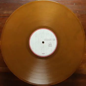 <u>PRESSING INFO</u><br><table class=inf_press><tbody><tr class=inf_info><td class=inf_title>Album:</td><td class=inf_info> From Here to Infirmary Past Live on Translucent Gold with Black Smoke  </td></tr>
    <td class=inf_title>Pressing:</td><td> First Pressing /500  </td></tr>
    <td class=inf_title>Release Date:</td><td> Dec. 1st 2014  </td></tr>
    <td class=inf_title>Album Pressed:</td><td> 2014  </td></tr>
    <td class=inf_title>Label:</td><td> Vagrant Records VR353  </td></tr>
    <td class=inf_title>Insert:</td><td> Double Sided Glossy  </td></tr>
    <td class=inf_title>Barcode:</td><td> 6 01091-03532 4  </td></tr>
    <td class=inf_title>Side A Matrix:</td><td> 14-0450 A MPO K SST NOISELAND  </td></tr>
    <td class=inf_title>Side B Matrix:</td><td> 14-0450 B K SST MPO NOISELAND  </td></tr>
    <td class=inf_title>&nbsp;</td><td> <a href=https://www.discogs.com/release/6433186 target=_blank rel=noopener noreferrer>View This Release on Discogs</a>  </tr></tbody></table>
<br><u>PRICING</u><span class='less' style='padding-left: 8px; color: var(--font-colour_grey);'>(prices shown in USD)</span><br><table class='inf_press'><tbody><tr class='inf_info'>
            <td class='inf_title'>Last Sold:</td>
            <td>$666.00 (May 19, 2026)</td>
            </tr><tr class='inf_info'>
            <td class='inf_title'>History:</td>
            <td>
                <span class='price-low' title='Sold on Oct 23, 2022'>Low: <span class='price-value'>$79.99</span></span>
                <span class='price-separator'>|</span>
                <span class='price-avg'>Avg: <span class='price-value'>$462.68</span></span>
                <span class='price-separator'>|</span>
                <span class='price-high' title='Sold on Jun 11, 2024'>High: <span class='price-value'>$700.00</span></span>
            </td>
            </tr></tbody></table><br>    <br><br><u>TRACKLIST</u><br><table class='inf_tracks'><tbody><tr>
            <td class='inf_num'>A1</td>
            <td class='inf_trk'>Private Eye</td>
            <td class='inf_len'>?:??</td>
            <td><a href='#' class='lyric-link' data-album-code='pl' data-song-title='Private Eye'>Lyrics</a></td></tr><tr>
            <td class='inf_num'>A2</td>
            <td class='inf_trk'>Mr. Chainsaw</td>
            <td class='inf_len'>?:??</td>
            <td><a href='#' class='lyric-link' data-album-code='pl' data-song-title='Mr. Chainsaw'>Lyrics</a></td></tr><tr>
            <td class='inf_num'>A3</td>
            <td class='inf_trk'>Take Lots With Alcohol</td>
            <td class='inf_len'>?:??</td>
            <td><a href='#' class='lyric-link' data-album-code='pl' data-song-title='Take Lots With Alcohol'>Lyrics</a></td></tr><tr>
            <td class='inf_num'>A4</td>
            <td class='inf_trk'>Stupid Kid</td>
            <td class='inf_len'>?:??</td>
            <td><a href='#' class='lyric-link' data-album-code='pl' data-song-title='Stupid Kid'>Lyrics</a></td></tr><tr>
            <td class='inf_num'>A5</td>
            <td class='inf_trk'>Another Innocent Girl</td>
            <td class='inf_len'>?:??</td>
            <td><a href='#' class='lyric-link' data-album-code='pl' data-song-title='Another Innocent Girl'>Lyrics</a></td></tr><tr>
            <td class='inf_num'>A6</td>
            <td class='inf_trk'>Steamer Trunk</td>
            <td class='inf_len'>?:??</td>
            <td><a href='#' class='lyric-link' data-album-code='pl' data-song-title='Steamer Trunk'>Lyrics</a></td></tr><tr>
            <td class='inf_num'>B1</td>
            <td class='inf_trk'>You’re Dead</td>
            <td class='inf_len'>?:??</td>
            <td><a href='#' class='lyric-link' data-album-code='pl' data-song-title='You’re Dead'>Lyrics</a></td></tr><tr>
            <td class='inf_num'>B2</td>
            <td class='inf_trk'>Armageddon</td>
            <td class='inf_len'>?:??</td>
            <td><a href='#' class='lyric-link' data-album-code='pl' data-song-title='Armageddon'>Lyrics</a></td></tr><tr>
            <td class='inf_num'>B3</td>
            <td class='inf_trk'>I’m Dying Tomorrow</td>
            <td class='inf_len'>?:??</td>
            <td><a href='#' class='lyric-link' data-album-code='pl' data-song-title='I’m Dying Tomorrow'>Lyrics</a></td></tr><tr>
            <td class='inf_num'>B4</td>
            <td class='inf_trk'>Bloodied Up</td>
            <td class='inf_len'>?:??</td>
            <td><a href='#' class='lyric-link' data-album-code='pl' data-song-title='Bloodied Up'>Lyrics</a></td></tr><tr>
            <td class='inf_num'>B5</td>
            <td class='inf_trk'>Trucks And Trains</td>
            <td class='inf_len'>?:??</td>
            <td><a href='#' class='lyric-link' data-album-code='pl' data-song-title='Trucks And Trains'>Lyrics</a></td></tr><tr>
            <td class='inf_num'>B6</td>
            <td class='inf_trk'>Crawl</td>
            <td class='inf_len'>?:??</td>
            <td><a href='#' class='lyric-link' data-album-code='pl' data-song-title='Crawl'>Lyrics</a></td></tr></tbody></table><br><br>
    <u>NOTES</u><br> This variant was exclusive to the Past Live Wood Box. Sleeve is specific to this pressing (different Vagrant logo font, etc) and differs from all other FHTI pressings. Runout etching is also specific to this pressing. This record only fits in it's box with the spine up or down (vs spine out)
 - B