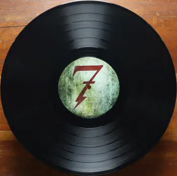 <u>PRESSING INFO</u><br><table class=inf_press><tbody><tr class=inf_info><td class=inf_title>Album:</td><td class=inf_info> This Addiction on Black  </td></tr>
    <td class=inf_title>Pressing:</td><td> Second Pressing /??  </td></tr>
    <td class=inf_title>Release Date:</td><td> Feb. 10th 2023  </td></tr>
    <td class=inf_title>Album Pressed:</td><td> 2023  </td></tr>
    <td class=inf_title>Label:</td><td> Heart&Skull Records/Epitaph 87075-1  </td></tr>
    <td class=inf_title>Insert:</td><td> Printed Satin Inner Sleeve  </td></tr>
    <td class=inf_title>Barcode:</td><td> 0 45778-70751 5  </td></tr>
    <td class=inf_title>Side A Matrix:</td><td> ALKALINE TRIO - THIS ADDICTION EPITAPH 87075-1 2017 A  </td></tr>
    <td class=inf_title>Side B Matrix:</td><td> ALKALINE TRIO - THIS ADDICTION EPITAPH 87075-1 2017 B  </td></tr>
    <td class=inf_title>&nbsp;</td><td> <a href=https://www.discogs.com/release/27328140 target=_blank rel=noopener noreferrer>View This Release on Discogs</a>  </tr></tbody></table>
<br><u>PRICING</u><span class='less' style='padding-left: 8px; color: var(--font-colour_grey);'>(prices shown in USD)</span><br><table class='inf_press'><tbody><tr class='inf_info'>
            <td class='inf_title'>Last Sold:</td>
            <td>$25.00 (Jan 14, 2026)</td>
            </tr><tr class='inf_info'>
            <td class='inf_title'>History:</td>
            <td>
                <span class='price-low' title='Sold on Aug 18, 2023'>Low: <span class='price-value'>$10.00</span></span>
                <span class='price-separator'>|</span>
                <span class='price-avg'>Avg: <span class='price-value'>$31.32</span></span>
                <span class='price-separator'>|</span>
                <span class='price-high' title='€39.99 · Sold on Dec 4, 2024'>High: <span class='price-value'>$45.54</span></span>
            </td>
            </tr></tbody></table><br>    <br><br><u>TRACKLIST</u><br><table class='inf_tracks'><tbody><tr>
            <td class='inf_num'>A1</td>
            <td class='inf_trk'>This Addiction</td>
            <td class='inf_len'>2:35</td>
            <td><a href='#' class='lyric-link' data-album-code='ta' data-song-title='This Addiction'>Lyrics</a></td></tr><tr>
            <td class='inf_num'>A2</td>
            <td class='inf_trk'>Dine, Dine My Darling</td>
            <td class='inf_len'>2:58</td>
            <td><a href='#' class='lyric-link' data-album-code='ta' data-song-title='Dine, Dine My Darling'>Lyrics</a></td></tr><tr>
            <td class='inf_num'>A3</td>
            <td class='inf_trk'>Lead Poisoning</td>
            <td class='inf_len'>2:37</td>
            <td><a href='#' class='lyric-link' data-album-code='ta' data-song-title='Lead Poisoning'>Lyrics</a></td></tr><tr>
            <td class='inf_num'>A4</td>
            <td class='inf_trk'>Dead On The Floor</td>
            <td class='inf_len'>4:20</td>
            <td><a href='#' class='lyric-link' data-album-code='ta' data-song-title='Dead On The Floor'>Lyrics</a></td></tr><tr>
            <td class='inf_num'>A5</td>
            <td class='inf_trk'>The American Scream</td>
            <td class='inf_len'>3:00</td>
            <td><a href='#' class='lyric-link' data-album-code='ta' data-song-title='The American Scream'>Lyrics</a></td></tr><tr>
            <td class='inf_num'>A6</td>
            <td class='inf_trk'>Off The Map</td>
            <td class='inf_len'>3:16</td>
            <td><a href='#' class='lyric-link' data-album-code='ta' data-song-title='Off The Map'>Lyrics</a></td></tr><tr>
            <td class='inf_num'>B1</td>
            <td class='inf_trk'>Draculina</td>
            <td class='inf_len'>3:34</td>
            <td><a href='#' class='lyric-link' data-album-code='ta' data-song-title='Draculina'>Lyrics</a></td></tr><tr>
            <td class='inf_num'>B2</td>
            <td class='inf_trk'>Eating Me Alive</td>
            <td class='inf_len'>2:53</td>
            <td><a href='#' class='lyric-link' data-album-code='ta' data-song-title='Eating Me Alive'>Lyrics</a></td></tr><tr>
            <td class='inf_num'>B3</td>
            <td class='inf_trk'>Piss And Vinegar</td>
            <td class='inf_len'>2:28</td>
            <td><a href='#' class='lyric-link' data-album-code='ta' data-song-title='Piss And Vinegar'>Lyrics</a></td></tr><tr>
            <td class='inf_num'>B4</td>
            <td class='inf_trk'>Dorothy</td>
            <td class='inf_len'>3:32</td>
            <td><a href='#' class='lyric-link' data-album-code='ta' data-song-title='Dorothy'>Lyrics</a></td></tr><tr>
            <td class='inf_num'>B5</td>
            <td class='inf_trk'>Fine</td>
            <td class='inf_len'>3:17</td>
            <td><a href='#' class='lyric-link' data-album-code='ta' data-song-title='Fine'>Lyrics</a></td></tr></tbody></table><br><br>
    <u>NOTES</u><br> Gatefold sleeve. Labels without Made in Canada
 - B