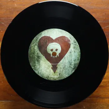 <u>PRESSING INFO</u><br><table class=inf_press><tbody><tr class=inf_info><td class=inf_title>Album:</td><td class=inf_info> This Addiction Single on UK Black  </td></tr>
    <td class=inf_title>Pressing:</td><td> First Pressing /??  </td></tr>
    <td class=inf_title>Release Date:</td><td> 2010  </td></tr>
    <td class=inf_title>Album Pressed:</td><td> 2010  </td></tr>
    <td class=inf_title>Label:</td><td> Heart&Skull/Hassle Records HOFF091S  </td></tr>
    <td class=inf_title>Insert:</td><td> none  </td></tr>
    <td class=inf_title>Barcode:</td><td> 5 060100-667997  </td></tr>
    <td class=inf_title>Side A Matrix:</td><td> HOFF 091S A-1  </td></tr>
    <td class=inf_title>Side B Matrix:</td><td> HOFF 091S B-1  </td></tr>
    <td class=inf_title>&nbsp;</td><td> <a href=https://www.discogs.com/release/3344785 target=_blank rel=noopener noreferrer>View This Release on Discogs</a>  </tr></tbody></table>
<br><u>PRICING</u><span class='less' style='padding-left: 8px; color: var(--font-colour_grey);'>(prices shown in USD)</span><br><table class='inf_press'><tbody><tr class='inf_info'>
            <td class='inf_title'>Last Sold:</td>
            <td><span title='Sold for £3.60'>$4.79</span> (Sep 7, 2025)</td>
            </tr><tr class='inf_info'>
            <td class='inf_title'>History:</td>
            <td>
                <span class='price-low' title='£2.00 · Sold on Jun 29, 2013'>Low: <span class='price-value'>$2.66</span></span>
                <span class='price-separator'>|</span>
                <span class='price-avg'>Avg: <span class='price-value'>$6.93</span></span>
                <span class='price-separator'>|</span>
                <span class='price-high' title='£12.00 · Sold on Aug 21, 2025'>High: <span class='price-value'>$15.98</span></span>
            </td>
            </tr></tbody></table><br>    <br><br><u>TRACKLIST</u><br><table class='inf_tracks'><tbody><tr>
            <td class='inf_num'>A1</td>
            <td class='inf_trk'>This Addiction</td>
            <td class='inf_len'>2:35</td>
            <td><a href='#' class='lyric-link' data-album-code='singles' data-song-title='This Addiction'>Lyrics</a></td></tr><tr>
            <td class='inf_num'>B1</td>
            <td class='inf_trk'>This Addiction (Acoustic)</td>
            <td class='inf_len'>2:38</td>
            <td><a href='#' class='lyric-link' data-album-code='singles' data-song-title='This Addiction (Acoustic)'>Lyrics</a></td></tr></tbody></table><br><br>
    <u>NOTES</u><br> Sleeve has Hassle Records markings and center label coloring is different than the US version. B side track is This Addiction (Acoustic Version)
 - B
