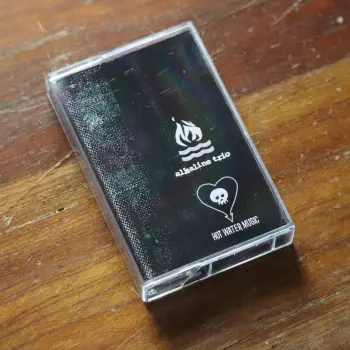 <u>PRESSING INFO</u><br><table class=inf_press><tbody><tr class=inf_info><td class=inf_title>Album:</td><td class=inf_info> Hot Water Music Split Cassette on Silver Cassette  </td></tr>
    <td class=inf_title>Pressing:</td><td> First Pressing /20  </td></tr>
    <td class=inf_title>Release Date:</td><td> 2026  </td></tr>
    <td class=inf_title>Album Pressed:</td><td> 2026  </td></tr>
    <td class=inf_title>Label:</td><td> Not For Profit Tapes  </td></tr>
    <td class=inf_title>Insert:</td><td> Printed Insert  </td></tr>
    <td class=inf_title>Barcode:</td><td> none  </td></tr>
    <td class=inf_title>Side A Matrix:</td><td> none  </td></tr>
    <td class=inf_title>Side B Matrix:</td><td> none  </td></tr>
    <td class=inf_title>&nbsp;</td><td> <a href= target=_blank rel=noopener noreferrer>View This Release on Discogs</a>  </tr></tbody></table>
    <br><br><u>TRACKLIST</u><br><table class='inf_tracks'><tbody><tr>
            <td class='inf_num'>A1</td>
            <td class='inf_trk'>Alkaline Trio - Queen Of Pain</td>
            <td class='inf_len'>3:57</td>
            <td><a href='#' class='lyric-link' data-album-code='cass' data-song-title='Alkaline Trio - Queen Of Pain'>Lyrics</a></td></tr><tr>
            <td class='inf_num'>A2</td>
            <td class='inf_trk'>Alkaline Trio - While You’re Waiting</td>
            <td class='inf_len'>4:07</td>
            <td><a href='#' class='lyric-link' data-album-code='cass' data-song-title='Alkaline Trio - While You’re Waiting'>Lyrics</a></td></tr><tr>
            <td class='inf_num'>A3</td>
            <td class='inf_trk'>Alkaline Trio - Rooftops</td>
            <td class='inf_len'>2:15</td>
            <td><a href='#' class='lyric-link' data-album-code='cass' data-song-title='Alkaline Trio - Rooftops'>Lyrics</a></td></tr><tr>
            <td class='inf_num'>B1</td>
            <td class='inf_trk'>Hot Water Music - God Deciding</td>
            <td class='inf_len'>2:37</td>
            <td><a href='#' class='lyric-link' data-album-code='cass' data-song-title='Hot Water Music - God Deciding'>Lyrics</a></td></tr><tr>
            <td class='inf_num'>B2</td>
            <td class='inf_trk'>Hot Water Music - Russian Roulette</td>
            <td class='inf_len'>3:25</td>
            <td><a href='#' class='lyric-link' data-album-code='cass' data-song-title='Hot Water Music - Russian Roulette'>Lyrics</a></td></tr><tr>
            <td class='inf_num'>B3</td>
            <td class='inf_trk'>Hot Water Music - Radio</td>
            <td class='inf_len'>4:12</td>
            <td><a href='#' class='lyric-link' data-album-code='cass' data-song-title='Hot Water Music - Radio'>Lyrics</a></td></tr><tr>
            <td class='inf_num'>B4</td>
            <td class='inf_trk'>Hot Water Music - Bleeder</td>
            <td class='inf_len'>3:13</td>
            <td><a href='#' class='lyric-link' data-album-code='cass' data-song-title='Hot Water Music - Bleeder'>Lyrics</a></td></tr></tbody></table><br><br>
    <u>NOTES</u><br> Not For Profit Tapes pressing. This is a bootleg tape, and not an official release. It seems that only around 20 of these tapes may have been made.
 - Cass