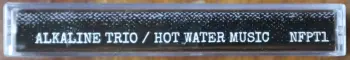 <u>PRESSING INFO</u><br><table class=inf_press><tbody><tr class=inf_info><td class=inf_title>Album:</td><td class=inf_info> Hot Water Music Split Cassette on Silver Cassette  </td></tr>
    <td class=inf_title>Pressing:</td><td> First Pressing /20  </td></tr>
    <td class=inf_title>Release Date:</td><td> 2026  </td></tr>
    <td class=inf_title>Album Pressed:</td><td> 2026  </td></tr>
    <td class=inf_title>Label:</td><td> Not For Profit Tapes  </td></tr>
    <td class=inf_title>Insert:</td><td> Printed Insert  </td></tr>
    <td class=inf_title>Barcode:</td><td> none  </td></tr>
    <td class=inf_title>Side A Matrix:</td><td> none  </td></tr>
    <td class=inf_title>Side B Matrix:</td><td> none  </td></tr>
    <td class=inf_title>&nbsp;</td><td> <a href= target=_blank rel=noopener noreferrer>View This Release on Discogs</a>  </tr></tbody></table>
    <br><br><u>TRACKLIST</u><br><table class='inf_tracks'><tbody><tr>
            <td class='inf_num'>A1</td>
            <td class='inf_trk'>Alkaline Trio - Queen Of Pain</td>
            <td class='inf_len'>3:57</td>
            <td><a href='#' class='lyric-link' data-album-code='cass' data-song-title='Alkaline Trio - Queen Of Pain'>Lyrics</a></td></tr><tr>
            <td class='inf_num'>A2</td>
            <td class='inf_trk'>Alkaline Trio - While You’re Waiting</td>
            <td class='inf_len'>4:07</td>
            <td><a href='#' class='lyric-link' data-album-code='cass' data-song-title='Alkaline Trio - While You’re Waiting'>Lyrics</a></td></tr><tr>
            <td class='inf_num'>A3</td>
            <td class='inf_trk'>Alkaline Trio - Rooftops</td>
            <td class='inf_len'>2:15</td>
            <td><a href='#' class='lyric-link' data-album-code='cass' data-song-title='Alkaline Trio - Rooftops'>Lyrics</a></td></tr><tr>
            <td class='inf_num'>B1</td>
            <td class='inf_trk'>Hot Water Music - God Deciding</td>
            <td class='inf_len'>2:37</td>
            <td><a href='#' class='lyric-link' data-album-code='cass' data-song-title='Hot Water Music - God Deciding'>Lyrics</a></td></tr><tr>
            <td class='inf_num'>B2</td>
            <td class='inf_trk'>Hot Water Music - Russian Roulette</td>
            <td class='inf_len'>3:25</td>
            <td><a href='#' class='lyric-link' data-album-code='cass' data-song-title='Hot Water Music - Russian Roulette'>Lyrics</a></td></tr><tr>
            <td class='inf_num'>B3</td>
            <td class='inf_trk'>Hot Water Music - Radio</td>
            <td class='inf_len'>4:12</td>
            <td><a href='#' class='lyric-link' data-album-code='cass' data-song-title='Hot Water Music - Radio'>Lyrics</a></td></tr><tr>
            <td class='inf_num'>B4</td>
            <td class='inf_trk'>Hot Water Music - Bleeder</td>
            <td class='inf_len'>3:13</td>
            <td><a href='#' class='lyric-link' data-album-code='cass' data-song-title='Hot Water Music - Bleeder'>Lyrics</a></td></tr></tbody></table><br><br>
    <u>NOTES</u><br> Not For Profit Tapes pressing. This is a bootleg tape, and not an official release. It seems that only around 20 of these tapes may have been made.
 - Spine